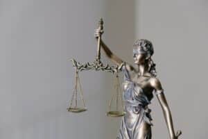 a statue of a person holding a scale