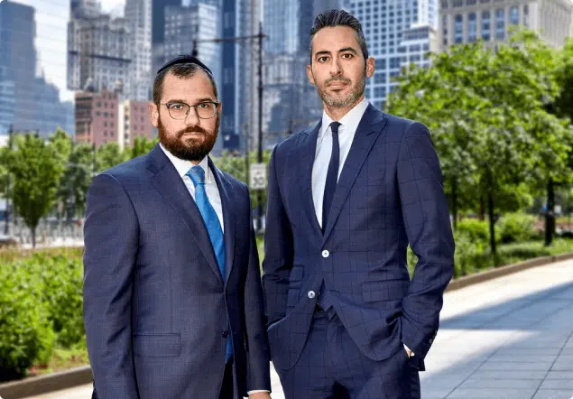 Alex Shulman and JJ Hill standing outdoors in the city