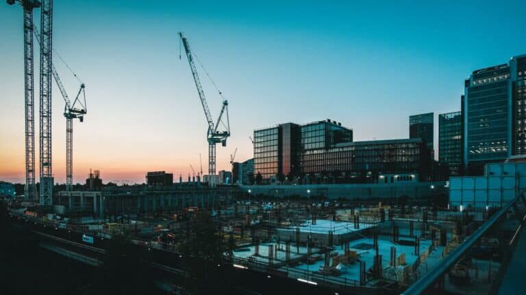 a construction site with a crane in the background