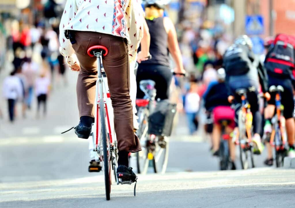a group of people riding bicycles