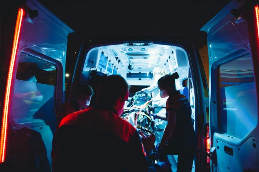 people in the back of a ambulance