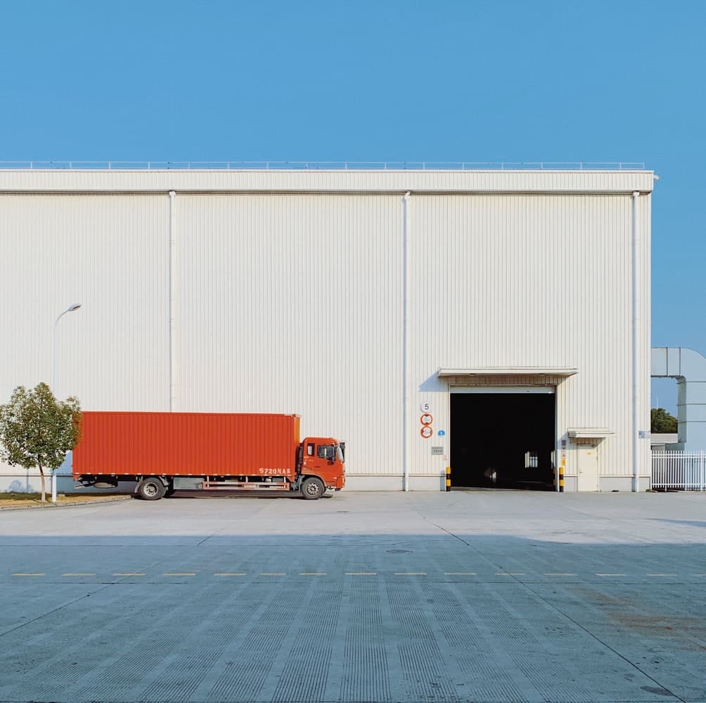 a truck parked outside of a building