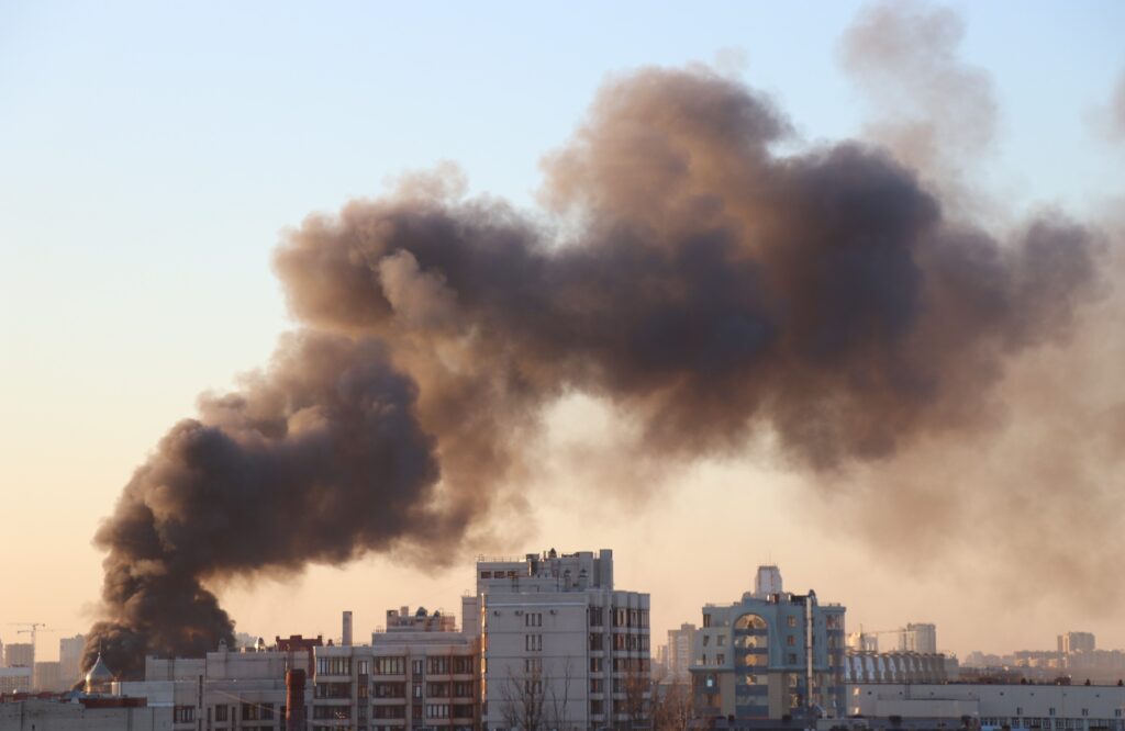 a black smoke coming out of a building