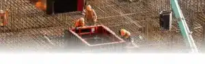 Workers working with concrete irons in a construction site.